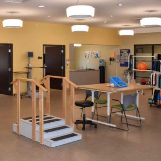 A rehabilitation center equipped with physical therapy tools and exercise areas.