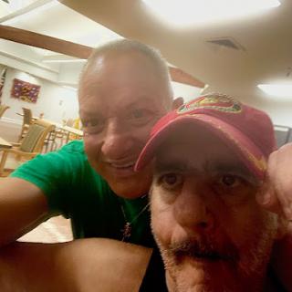 A joyful moment captured in a selfie with friends.