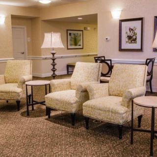 A cozy lounge area with comfortable seating and elegant decor.