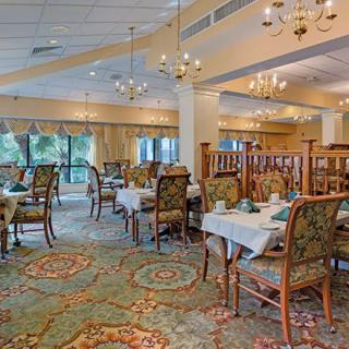 Elegant dining room with neatly arranged tables and classic decor.