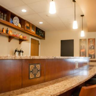 A stylish bar area with pendant lighting and modern design elements.