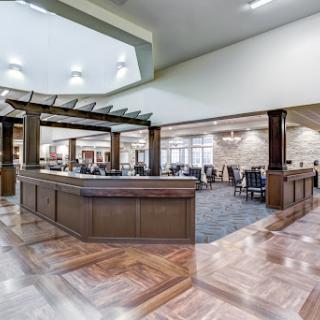 A modern lobby showcasing elegant wooden finishes and spacious design.