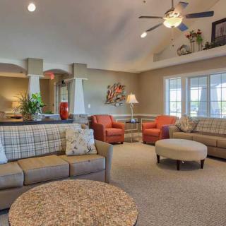 Spacious and elegantly decorated living room with comfortable seating and neutral tones.