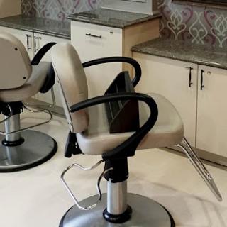 Stylish salon chairs ready for clients at a modern hairdressing studio.