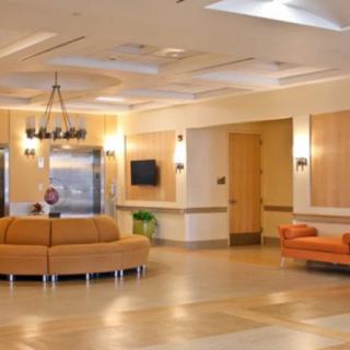 A modern lobby with comfortable seating and warm lighting.