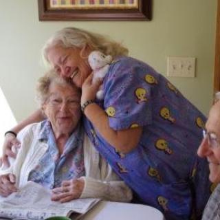 A warm embrace shared among family members around a table.