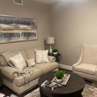 Cozy living room with neutral tones and modern decor.