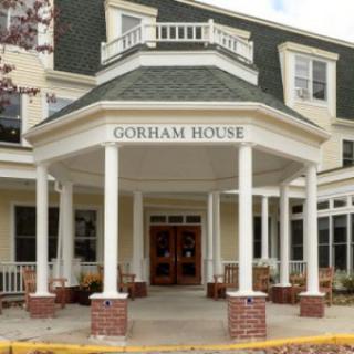 The entrance of Gorham House with a welcoming porch and columns.