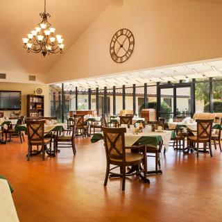 A spacious dining area with elegant decor and abundant natural light.