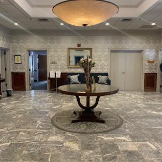 A spacious hotel lobby featuring elegant decor and a welcoming atmosphere.
