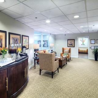 A well-decorated waiting room with comfortable seating and tasteful decor.