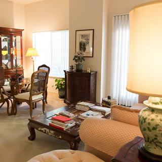 A cozy living room with an elegant dining area and classic furniture.
