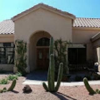 A desert home featuring native cacti and southwestern architecture.