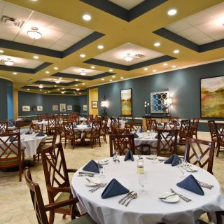 Elegant restaurant dining area with neatly arranged tables and chairs.