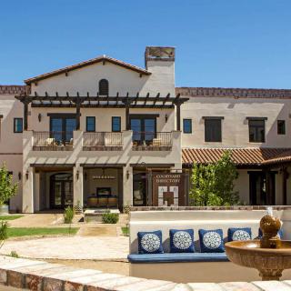 A luxurious residential home with a spacious patio and garden area.