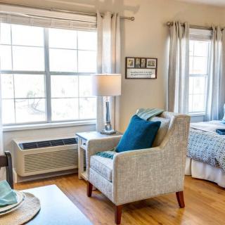 A cozy living space with a comfortable armchair near a bright window.