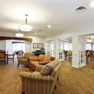 A cozy living room with comfortable seating and warm lighting.