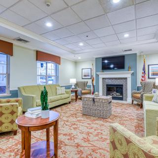 A cozy living room with comfortable seating and a fireplace.