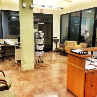 Reception area with seating and a front desk.