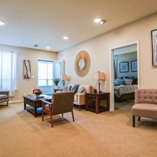 A modern and cozy living room with comfortable seating and elegant decor.