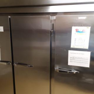 A stainless steel refrigerator with closed doors, typically used in a kitchen or commercial setting.