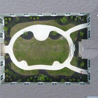 Aerial view of a courtyard with unique landscaping and pathways.