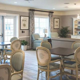 A cozy and elegantly decorated living space with comfortable seating and ample natural light.