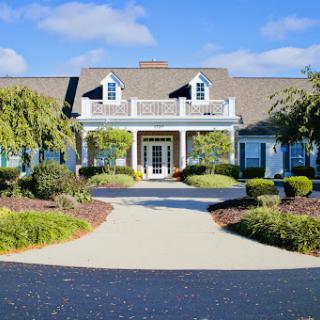 A charming house with well-maintained landscaping and a welcoming entrance.