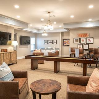 A stylish and cozy lounge area with modern decor and comfortable seating.