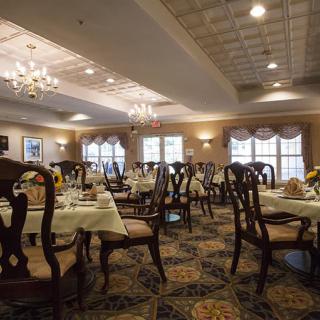 Elegantly decorated restaurant dining area with neatly arranged tables and chairs.