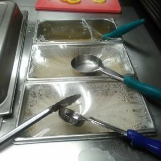 An organized kitchen setup with utensils ready for food preparation.