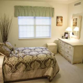 A cozy bedroom with elegant decor and classic furniture.