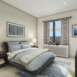 A modern bedroom with stylish decor and natural lighting.