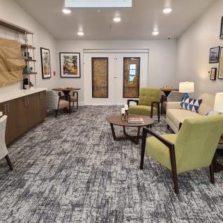 A modern and cozy waiting room with stylish furniture and decor.