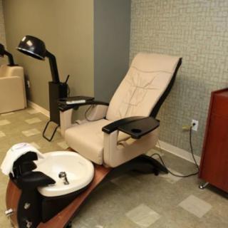 A comfortable pedicure chair in a modern salon setting.