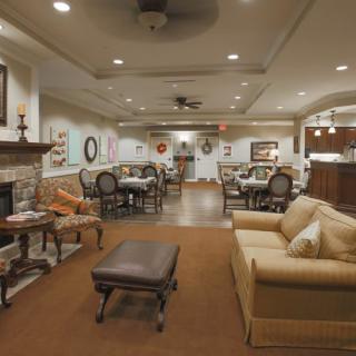 A cozy living and dining area with elegant decor and comfortable seating.