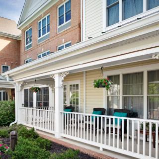 A cozy residential house with a welcoming porch and garden.