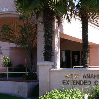 Entrance to the West Anaheim Extended Care facility with palm trees and signage.