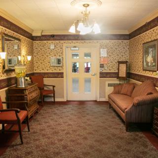 A cozy living room with elegant decor and comfortable seating.