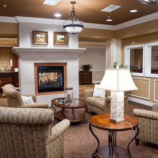 A cozy living room with elegant furniture and a fireplace.