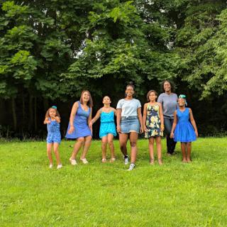 A joyful gathering of children enjoying a sunny day in the park.