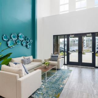 A modern living room with stylish decor and comfortable seating.