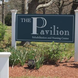 The Pavilion Rehabilitation and Nursing Center sign amidst a well-maintained landscape.