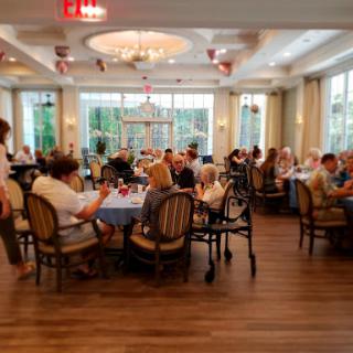 A lively dining area filled with people enjoying their meals and conversations.
