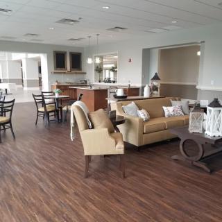A spacious and elegantly decorated living area featuring comfortable seating and stylish furnishings.