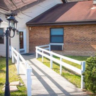 An accessible ramp leading to the entrance of a building.