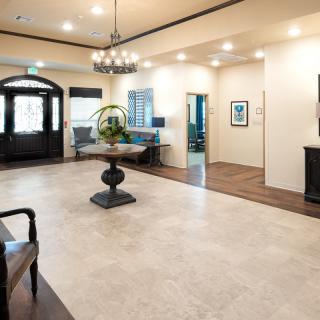 A spacious and elegant lobby area featuring stylish furniture and ambient lighting.