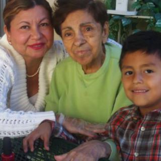A multigenerational family portrait taken outdoors.