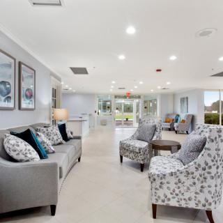 A modern and spacious living room with elegant furniture and bright decor.