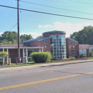 A modern healthcare facility featuring a combination of brick and glass architecture.